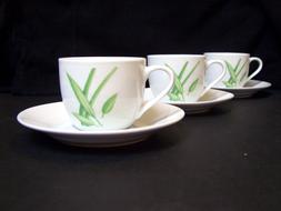 white cups with green branches