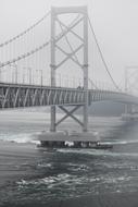 bridge over the naruto strait in the fog