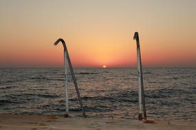 metal railing of the stairs on the background of sunset