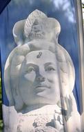 White statue of the woman, on the flag