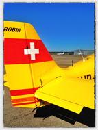 yellow plane at the airport