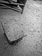 old wooden stool in black and white background