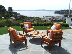 Beautiful and colorful landscape with Teak Patio Furniture near the plants and water
