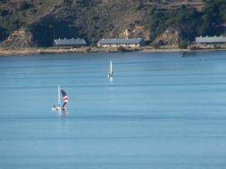 panoramic view of the sailboat and catamaran on a sunny day