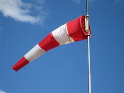 White Red Windsock at blue Sky