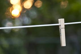 clothespin on clothesline on blurred background