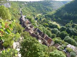 Beautiful and colorful landscape of the village, among the plants and mountains, in the summer