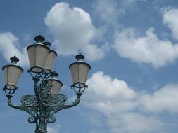 Close-up of the lantern, under the blue sky with clouds