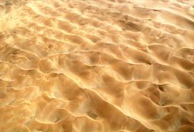 Sand with waves in the desert, in light