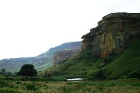 sandstones on green slopes