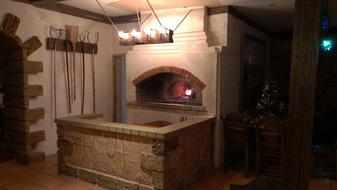 Beautiful Russian oven and other furniture in the cafe, with lights