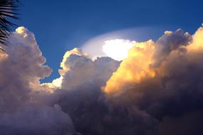 storm clouds, blue sky, sun