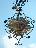 iron sign with sun