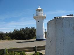 white lighthouse on a clear sunny day