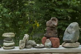 Close-up of the colorful sculptures made of the rocks, near the plants