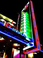 Cinema building with colorful lights, at the night
