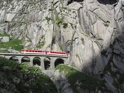 train on bridge in SchÃ¶llenen Gorge, switzerland, Gotthard