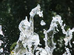 Fountain Jet Water close-up in blurred background