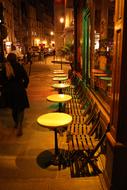 chairs in a bistro in paris at night