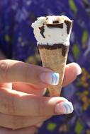 ice cream cone in the girl's hand