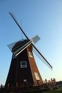 Beautiful landscape with the windmill, at beautiful and colorful sky