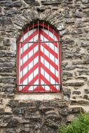 red and white Window on Castle Wall