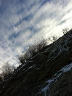 cliff in the snow in the evening