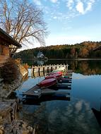Beautiful landscape with the pier of Walchensee, among the colorful plants, in Upper Bavaria, Germany