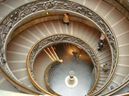 Beautiful spiral stairs with ornaments, in the cathedral in Vatican