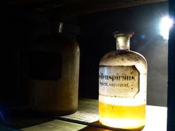 drugstore bottle with yellow liquid