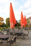 orange parasols in a street cafe