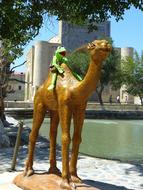 Camel Figure near Pond Water
