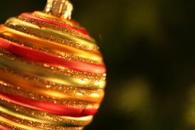 striped christmas ball on blurred background