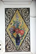 Beautiful and colorful, vintage painting with flowers, on the door