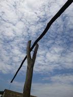 wooden lever on the background of the cloudy sky