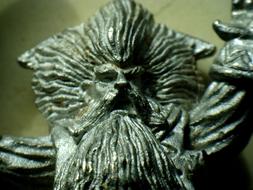 Shiny figure of lead of the magician