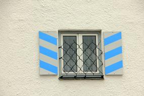 lattice on a blue white window