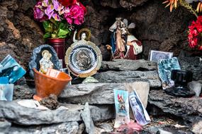 Colorful memorial with flowers, among the rocks, in El Golfo, Lanzarote