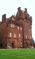 Beautiful castle near the green grass, in Brodickl, Arron, Scotland