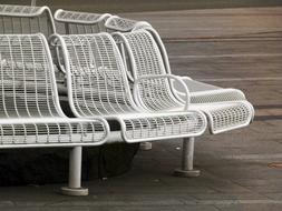 White Metal Bench on a wooden deck