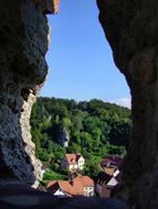 Beautiful buildings on the mountains with green trees, in Franconian Switzerland, Germany