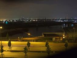 Cityscape with the Elbe River and bridge, in Hamburg, Germany, with lights, at the night