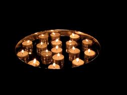 Tea Lights Candles Burn at dark