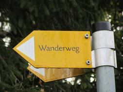 Wanderweg on the yellow sign