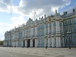 Beautiful and colorful Hermitage building in St Petersburg, Russia, under the blue sky with clouds
