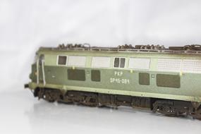 metal model of a train on a white background