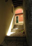 View of the colorful building through the entrance to stairs, in light