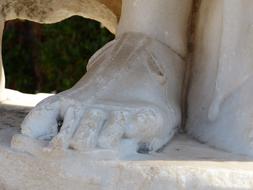 Close-up of the white, antique foot of the sculpture in Ephesus, Turkey