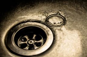 Water Drops in a dark sink