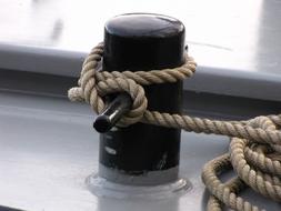 Close-up of the pulley rope on the boat in the harbor